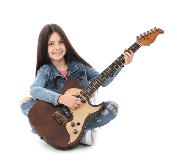 Little cheerful girl playing guitar, isolated on white - Foto, Imagen