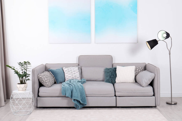 Stylish living room interior with comfortable sofa - Foto, Imagem