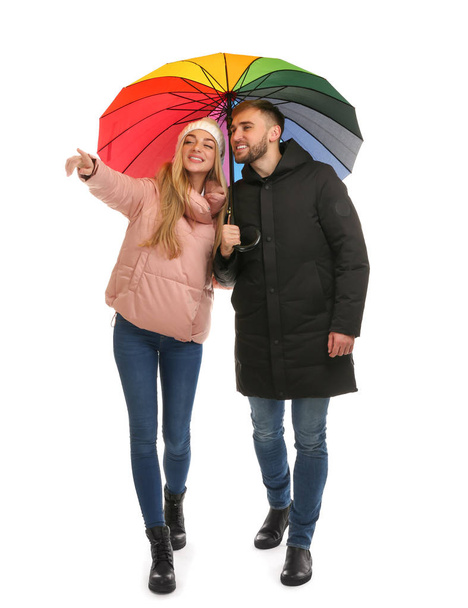 Full length portrait of beautiful couple with umbrella, isolated on white - Foto, Imagem