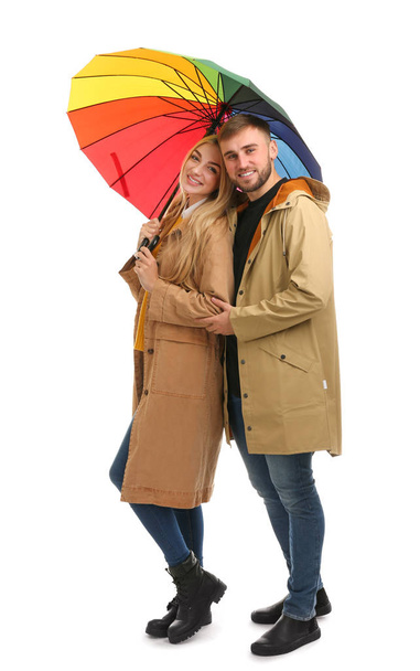Full length portrait of beautiful couple with umbrella, isolated on white - Fotoğraf, Görsel