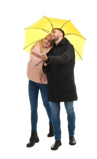 Full length portrait of beautiful couple with umbrella, isolated on white - Foto, Bild