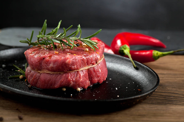 Fresh grilled meat. Grilled beef steak medium rare on wooden cutting board. Top view. - Foto, immagini