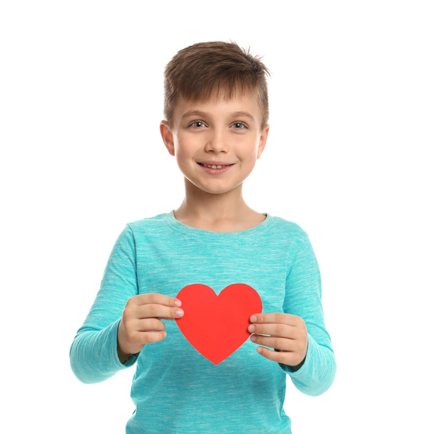Cute boy with decorative heart on white background - Фото, изображение