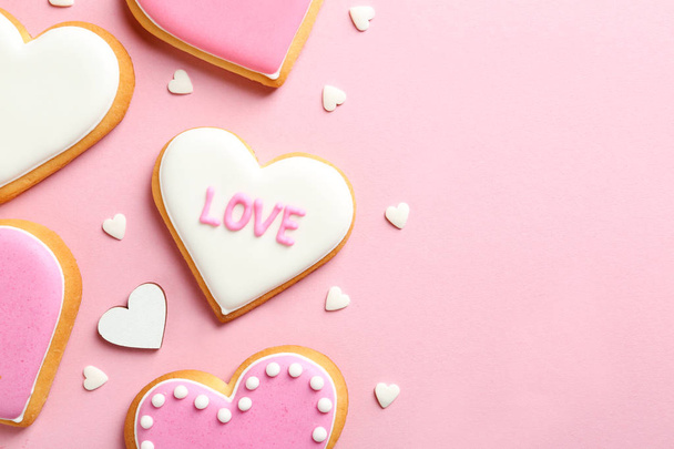 Composition with decorated heart shaped cookies and space for text on color background, top view. Valentine's day treat - Fotoğraf, Görsel