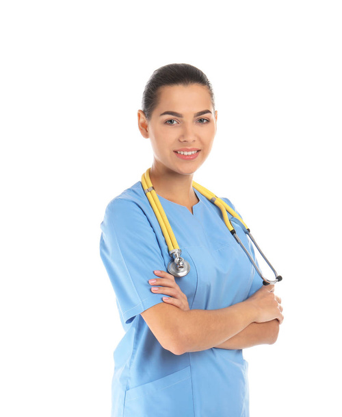Portrait of young medical assistant with stethoscope on white background - Photo, Image