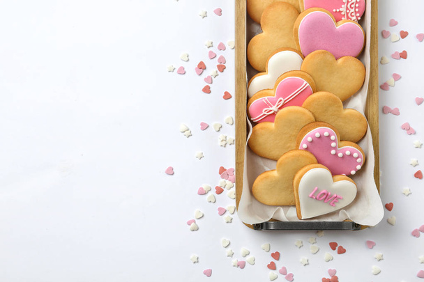 Tray with decorated heart shaped cookies and space for text on white background, top view - Foto, Imagen