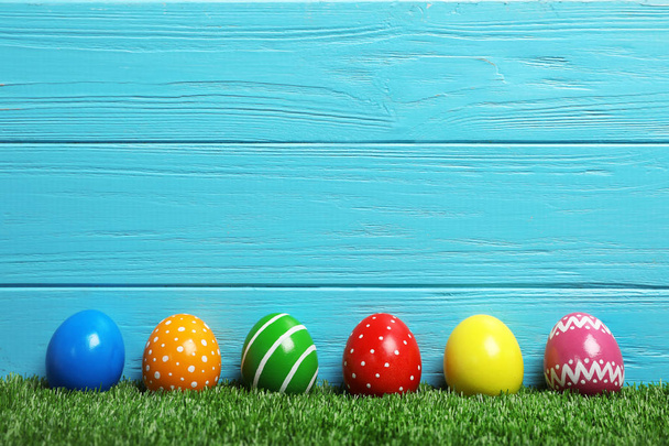 Decorated Easter eggs on green grass. Space for text - Fotografie, Obrázek