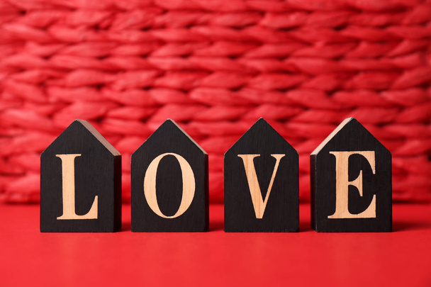 Word Love made with decorative letters on color background - Фото, изображение