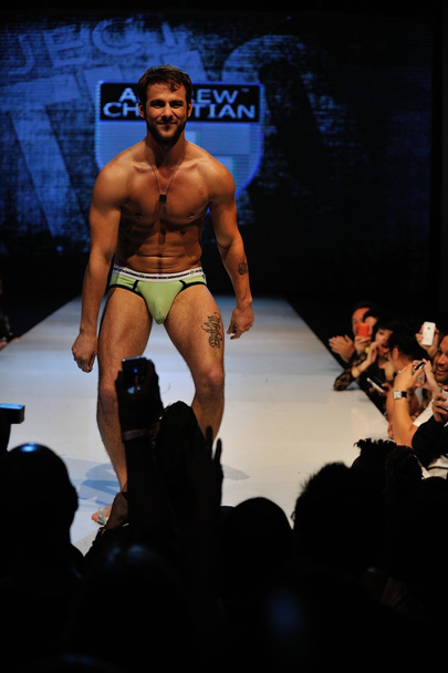 Los Angeles - March 12: A male model walks the runway at the Andrew Christian Fall Winter 2013 fashion show during Project Ethos Fashion event at club Avalon on March 12, 2013 in Los Angeles, CA - Foto, Imagen