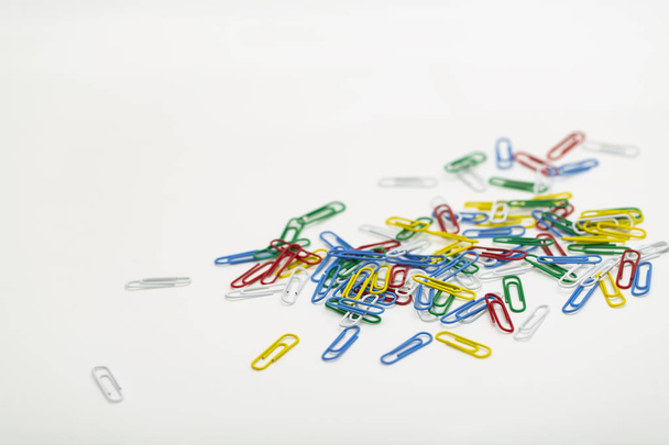Colored paper clips isolated on white background. - Foto, imagen
