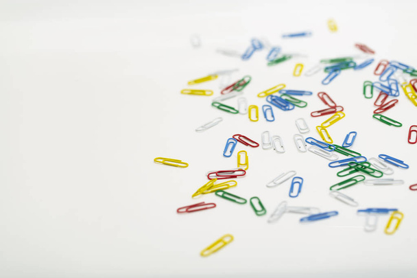 Colored paper clips isolated on white background. - Φωτογραφία, εικόνα
