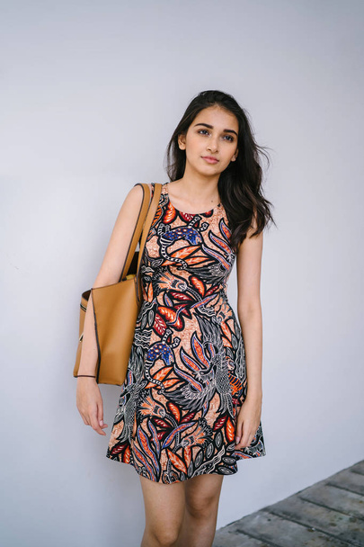 Fashion portrait of a beautiful, young and slim Indian Asian girl in dress posing - Foto, immagini