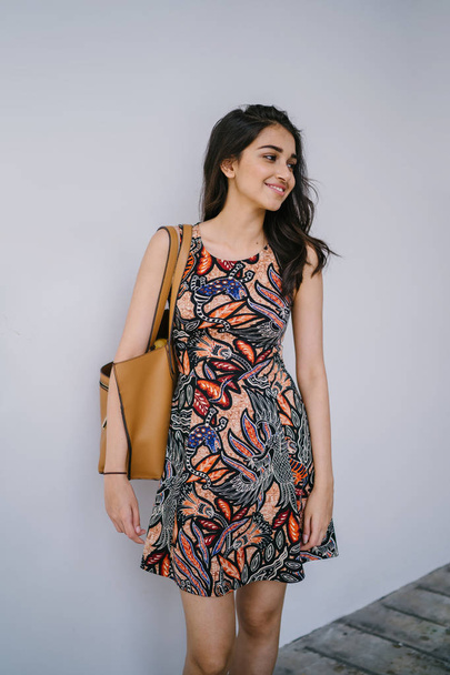 Fashion portrait of a beautiful, young and slim Indian Asian girl in dress posing - Photo, Image