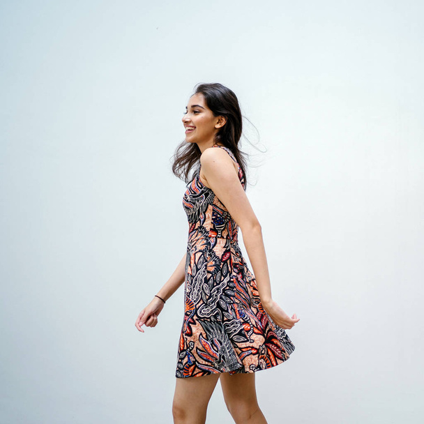 Fashion portrait of a beautiful, young and slim Indian Asian girl in dress posing - Fotografie, Obrázek