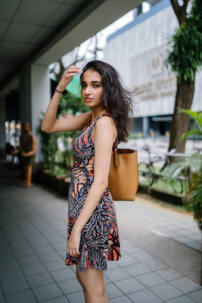 Fashion portrait of a beautiful, young and slim Indian Asian girl in dress posing - Foto, afbeelding