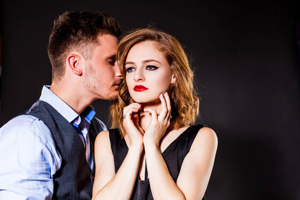 Portrait of young passionate couple in the studio - 写真・画像
