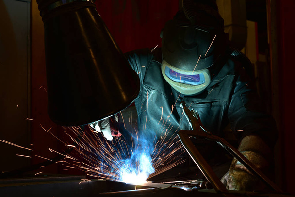 welder, craftsman, erecting technical steel Industrial steel welder in factory - Photo, Image