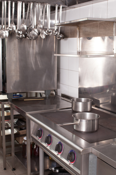 Professional kitchen in a restaurant, electric cooking surface - Fotó, kép