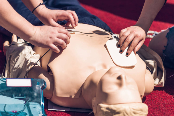 First Aid Training. Defibrillator CPR Practice - Photo, Image