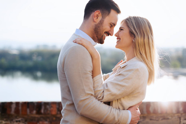 Happy couple in love smiling and dating outdoor - Foto, Imagen