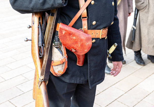 Vintage leather holster and other ammunition on the belt. Retro uniform of russian navy during Russian Civil War in 1918 - Photo, Image