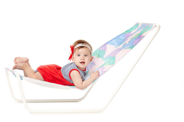 cute baby lying on lounger - Foto, afbeelding