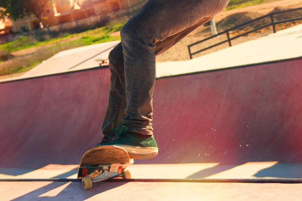 Teenage skateboarder boldly makes extreme jumps on a skateboard - Φωτογραφία, εικόνα