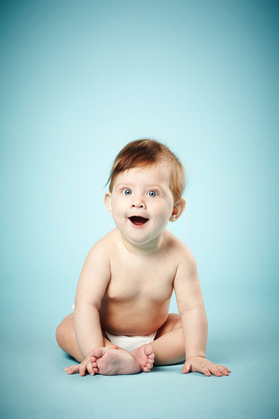 cute happy baby on blue background - Fotografie, Obrázek
