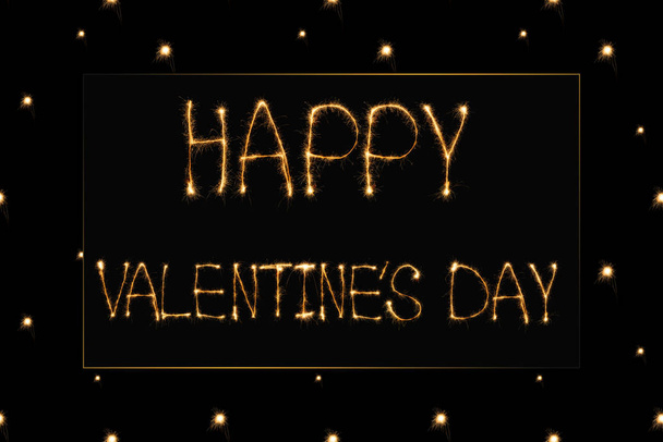 close up view of happy valentines day light lettering on black background, st valentines day concept - Foto, Bild