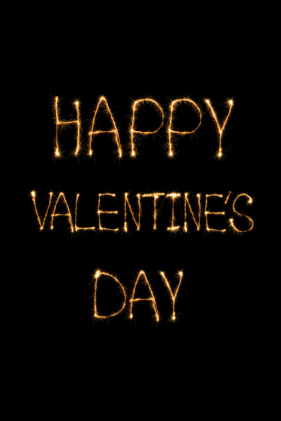 close up view of happy valentines day light lettering on black background, st valentines day concept - Foto, immagini