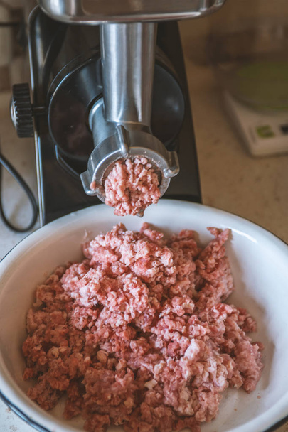 meat is ground in a meat grinder - Photo, image