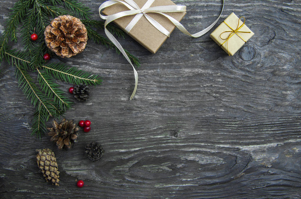 Christmas gift boxes on a rustic wooden background - 写真・画像