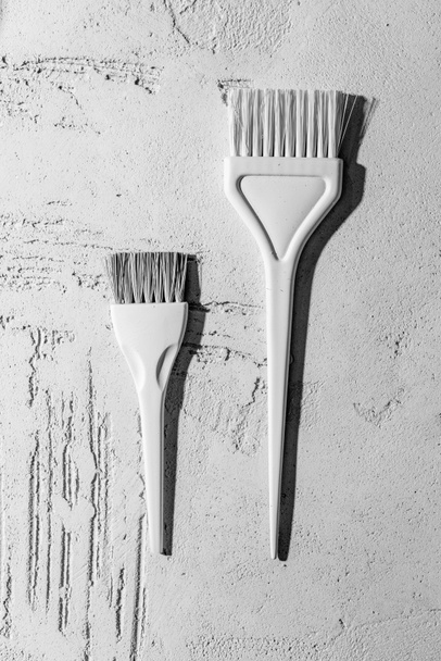 close-up view of decorative white brushes on wall in beauty salon - Photo, Image