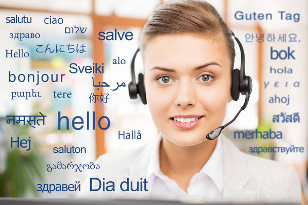 woman in headset over words in foreign languages - Foto, immagini