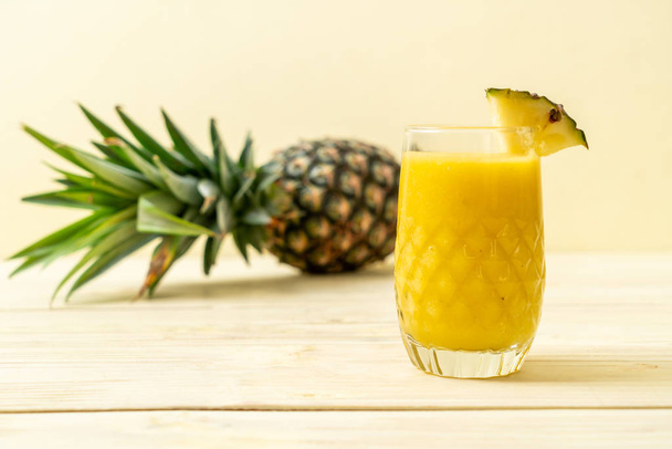 fresh pineapple smoothie glass on wood table - Healthy Drink - Foto, Imagen