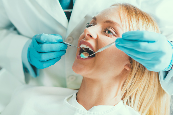 Young Woman Having a Dental Check-up - Фото, зображення