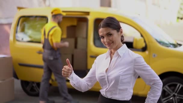 Beautiful business woman show a thumb up. Outdoor - Materiał filmowy, wideo