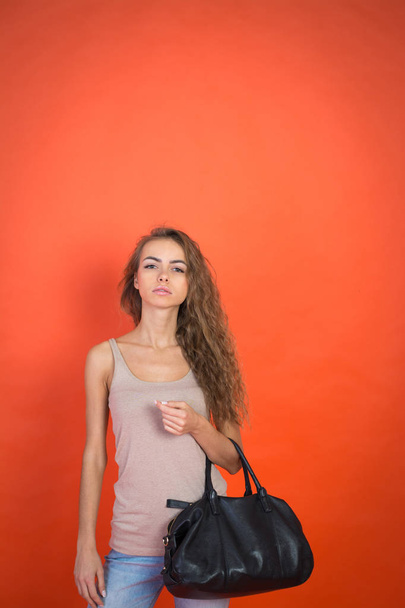 stylish young girl with a black bag - Fotografie, Obrázek