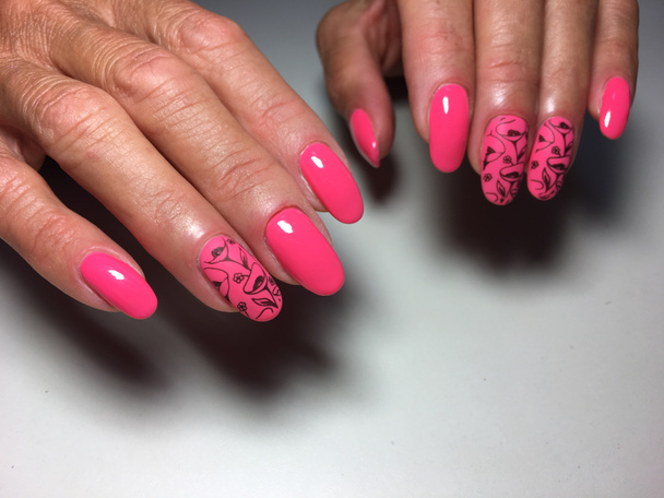 fashionable glossy and matte pink manicure with flowers - Photo, Image