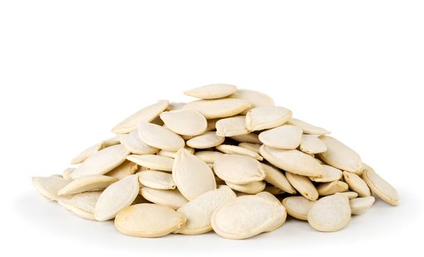 Bunch of pumpkin seeds on a white, isolated. - Photo, Image