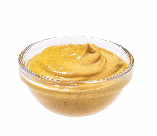 Small glass  bowl of mustard sauce, isolated on white background - Photo, Image