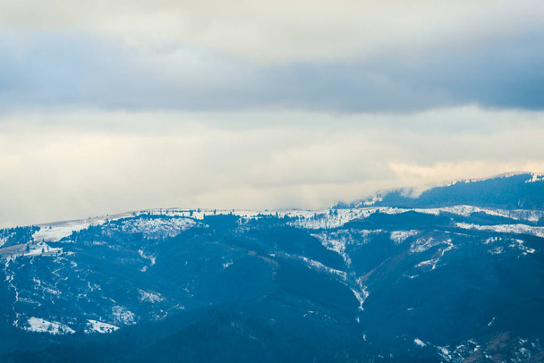 Landscape of snowy mountains in winter, Romania. - 写真・画像