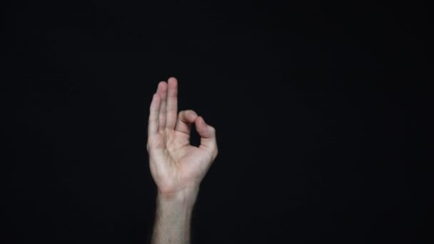 Hand in OK sign on a black isolated background. Everything is in order. - Footage, Video