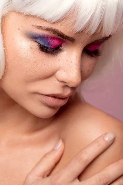 Beauty portrait of attractive woman in colorful glamour makeup and white wig. - Zdjęcie, obraz
