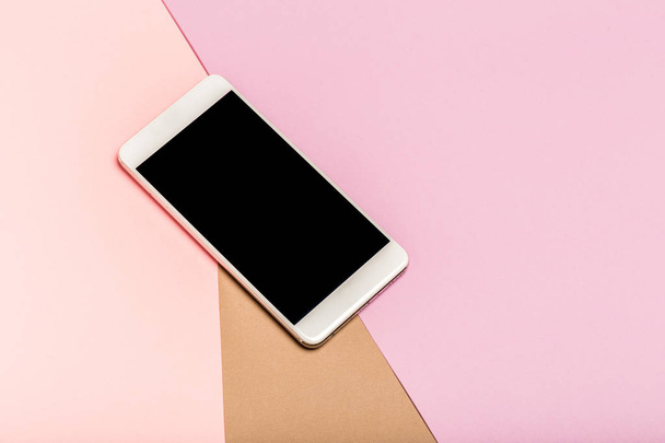 mobile phone on top view,background in pastel colors. - Foto, immagini