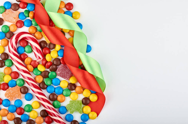 Abstract pattern with round color candy on background. Colorful sweets top view. Flat lay image. - Fotoğraf, Görsel
