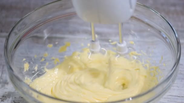 Beat the butter for cake in a bowl, Close up. - Filmati, video