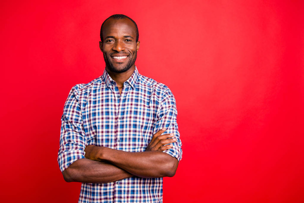 Portrait of nice handsome well-groomed attractive cheerful positive cheery guy wearing checked shirt isolated over bright vivid shine red background - Fotografie, Obrázek