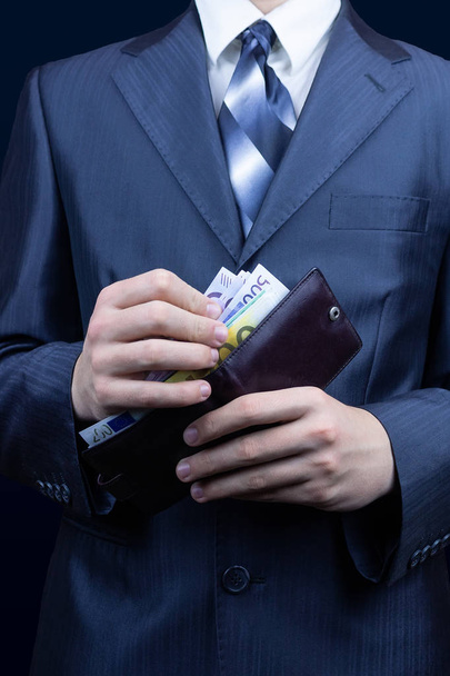 The man in the suit removes the money in the wallet, the businessman wallet Euro - Fotoğraf, Görsel