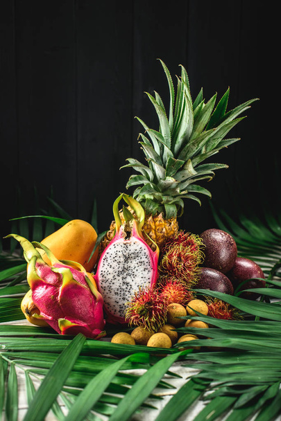Set of exotic fruits. Assorted tropical fruits of pineapple, rambutan, passion fruit, mango, dragon fruit, longan - Fotografie, Obrázek
